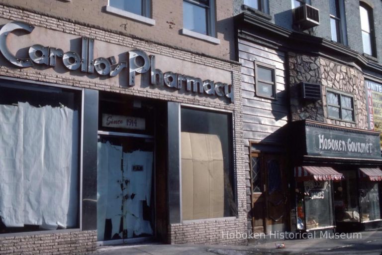 Color slide of the former Carollo's Pharmacy, 425 Washington St., corner of Fifth Street, Hoboken, 1984. picture number 1