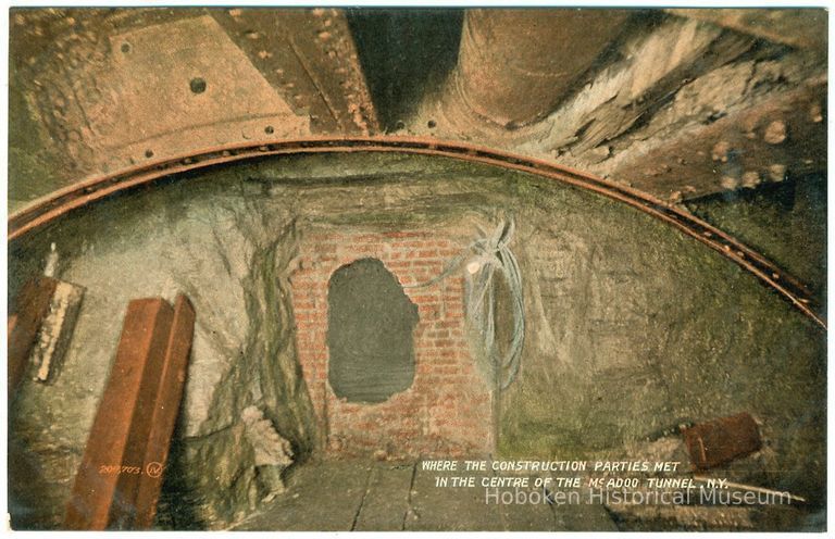 Digital image of Hudson & Manhattan R.R. postcard titled: Where the construction parties met in the centre of the McAdoo Tunnel, N.Y. n.d., ca. 1908. picture number 1