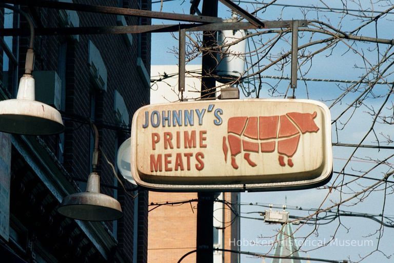 Color photo of a hanging sign for Johnny's Prime Meats, 230 Clinton Street, Hoboken, Jan. 3 & 4, 2002. picture number 1