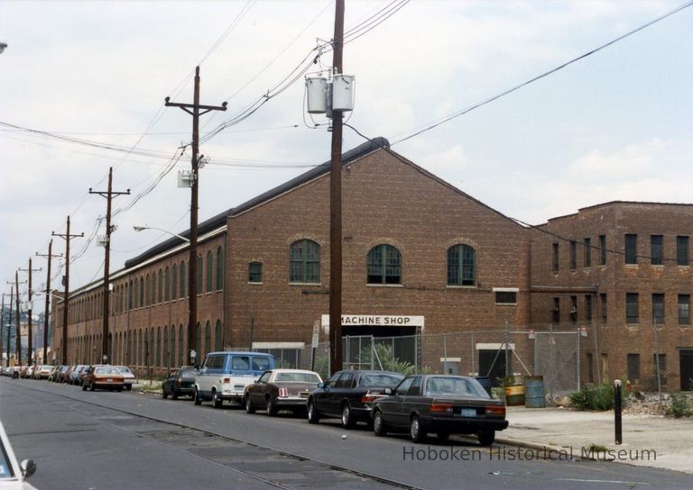 1: view northeast of Machine Shop building from N of 12th St. towards 14th