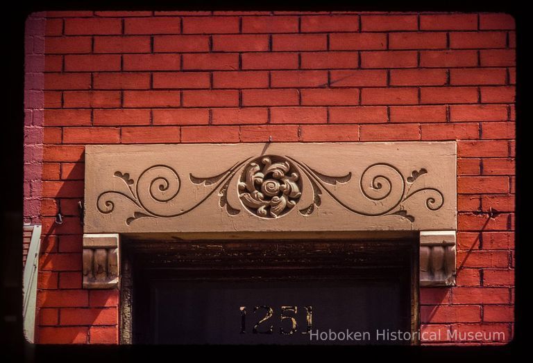 Color slide of close-up view of portico door head at 1251 Garden on the SE corner with 13th picture number 1