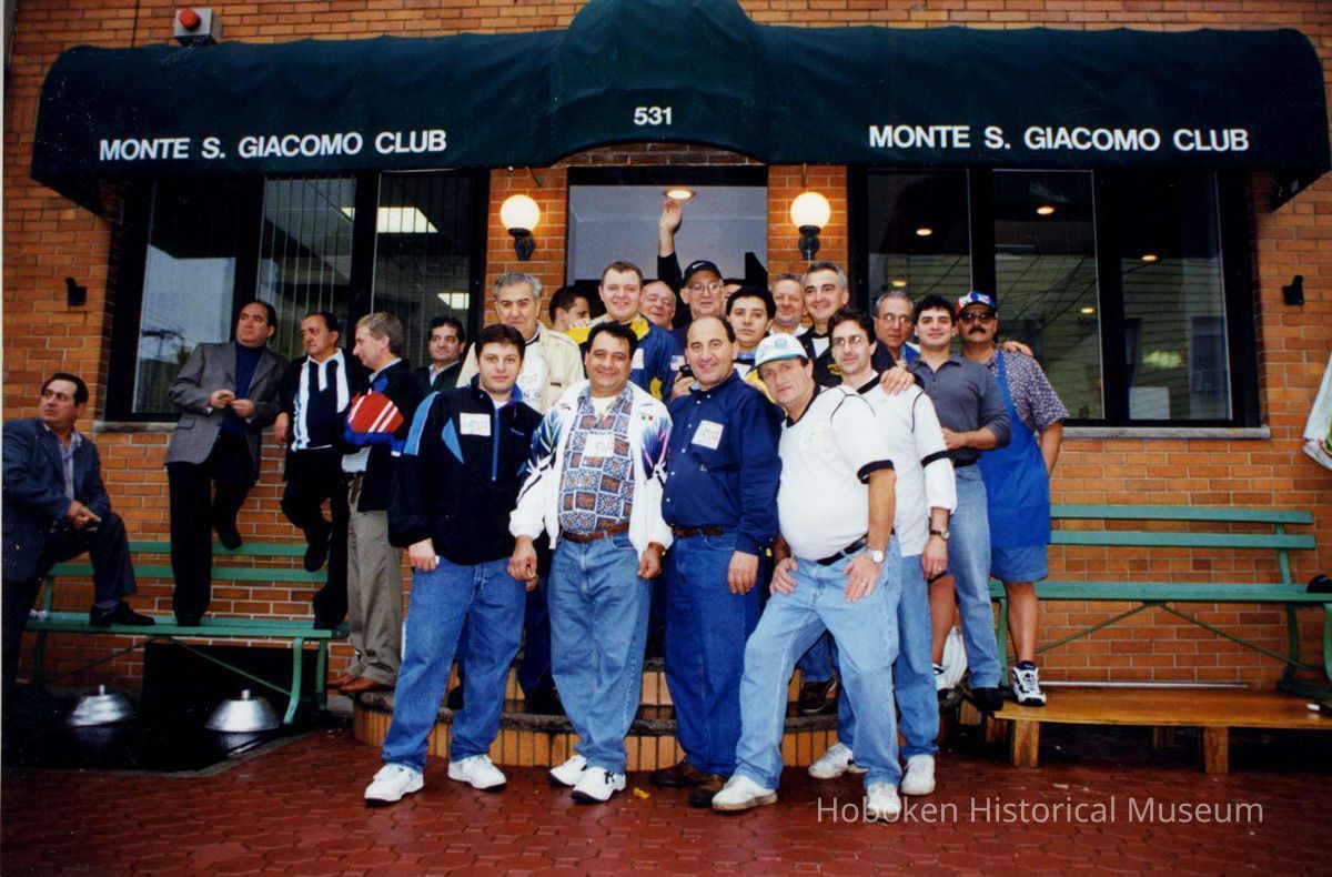 Color group photo of members of the Monte San Giacomo Democratic Club, Inc. outside the building at 531 Adams St., Hoboken, no date, ca. 2000. picture number 1