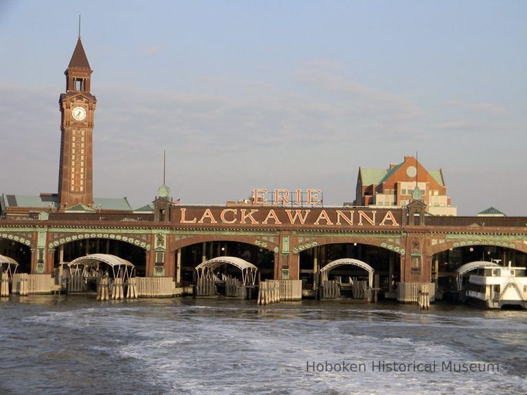 Photo 1: exterior showing several ferry slips; clock tower