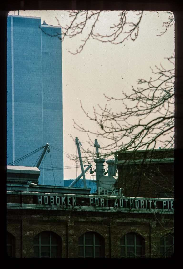 Color slide of detail view of Pier C marine terminal signage looking E from Stevens Park with the World Trade Center in the background picture number 1