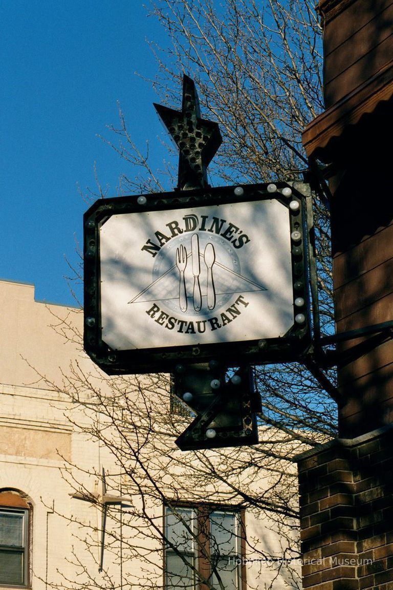 Color photo of hanging sign for Nardine's Restaurant, 615 First St. at Jackson Street, Hoboken, Jan. 3 & 4, 2002. picture number 1