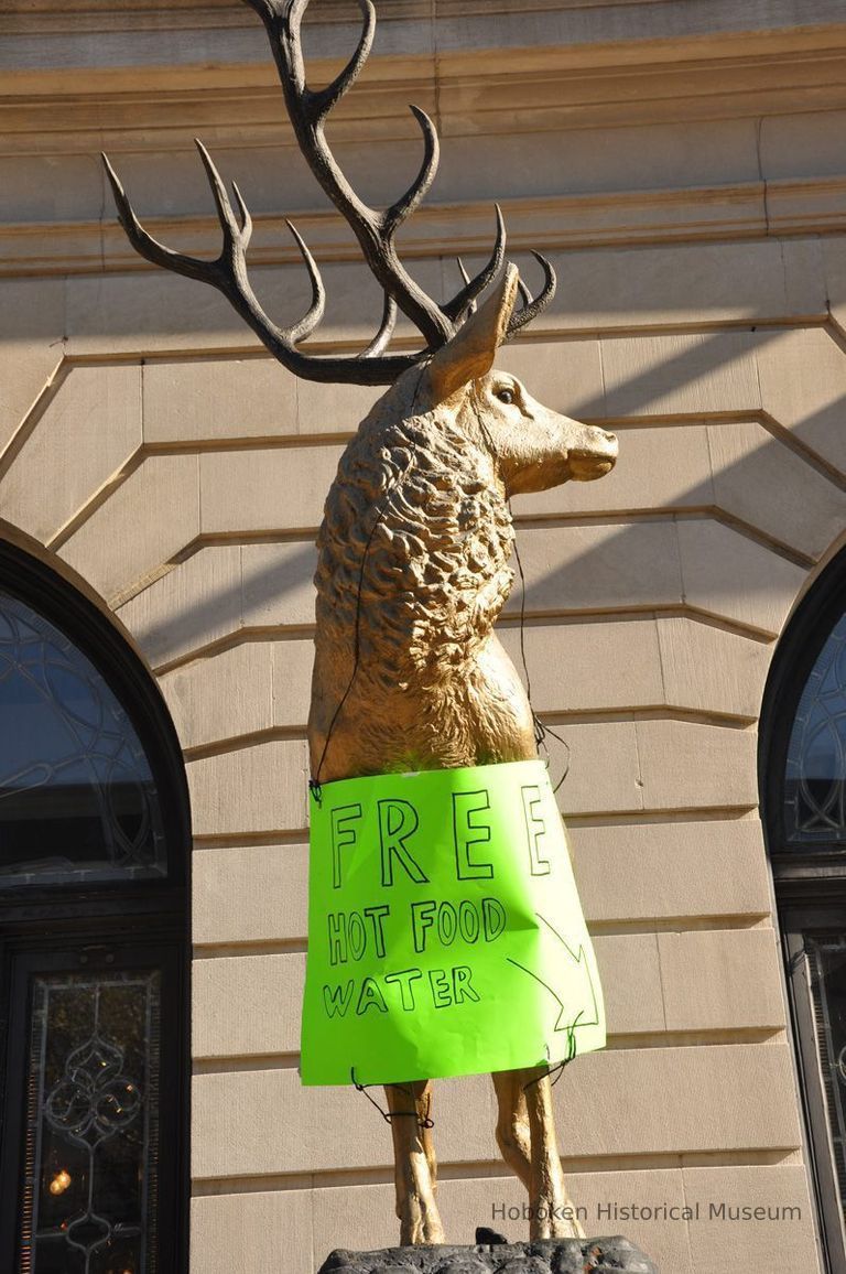 Elks statue with sign: Free Hot Food Water