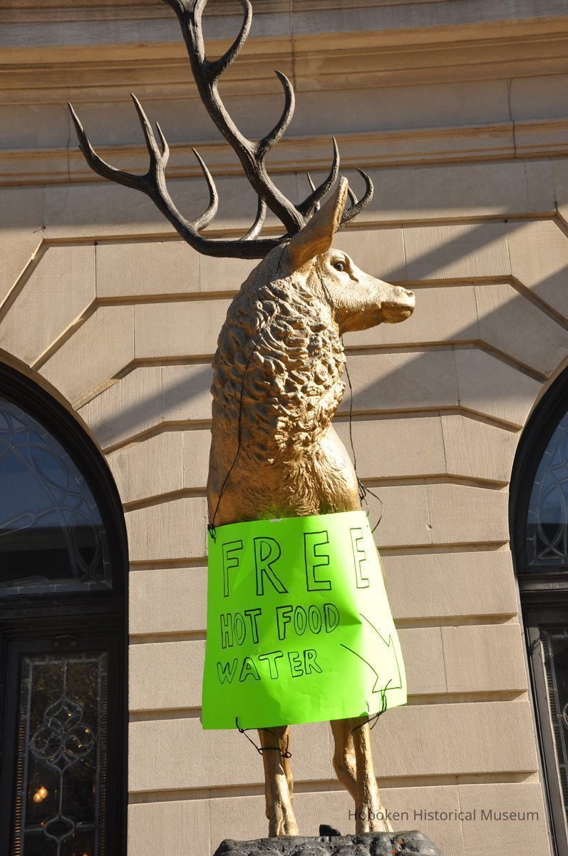 Elks statue with sign: Free Hot Food Water