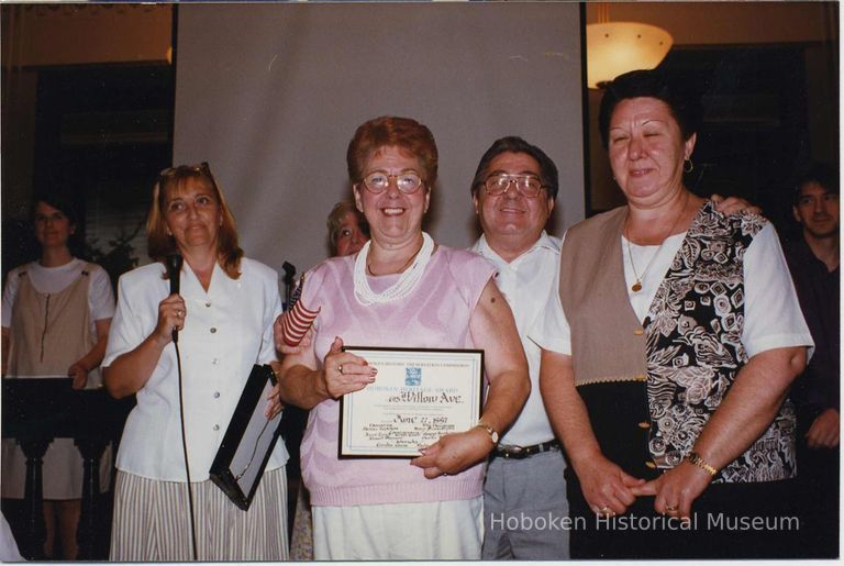 Color photo of the owners of 615 Willow Avenue receiving framed Hoboken Heritage Award, Hoboken City Hall, June 27, 1997. picture number 1