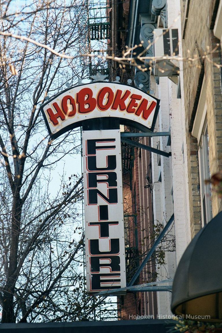 Color photo of hanging sign for Hoboken Furniture, 157 First Street, Hoboken, Jan. 3 & 4, 2002. picture number 1