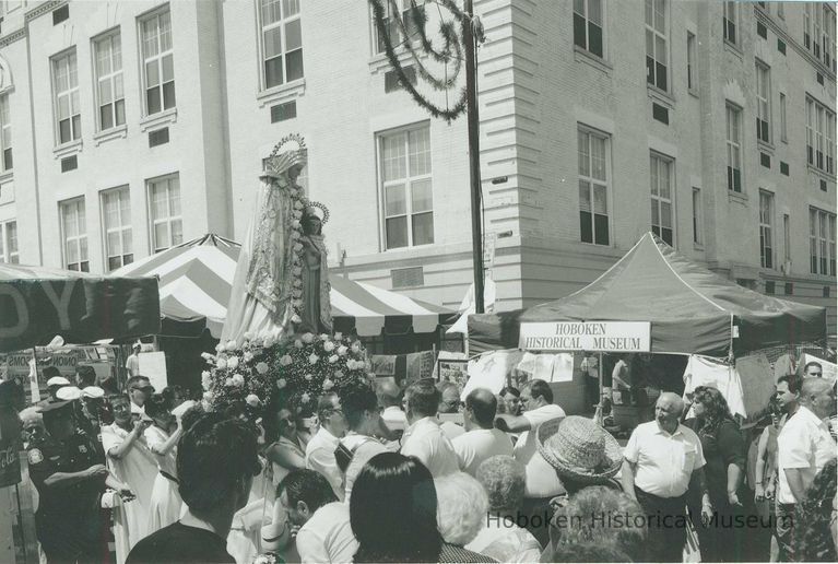 B+W photo of the St. Ann's Feast procession of the Madonna passing the Hoboken Historical Museum's booth, Hoboken, July, 2000. picture number 1