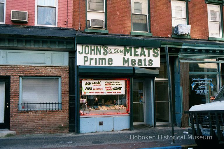 Color photo of sign for John's & Son Meats, 305 First St, Hoboken, Jan. 3 & 4, 2002. picture number 1