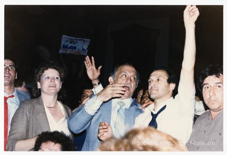 Color photo of mayoral candidate Tom Vezzetti in front of City Hall with supporters on election night, Hoboken, [June 11, 1985]. picture number 1