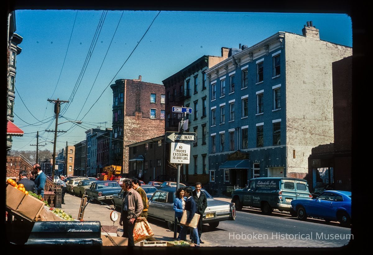 Color slide of eye-level view of street scene with a produce truck on the NW corner of Park and 2nd looking N picture number 1