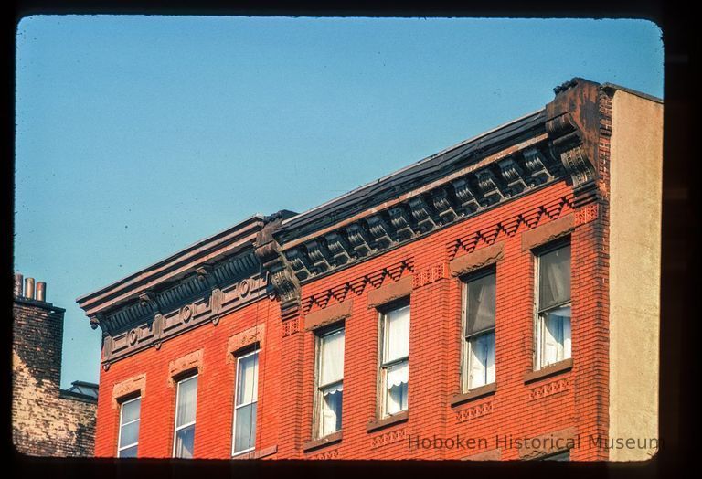 Color slide of detail view of cornices, brackets, friezes, window heads and brickwork on two unidentified buildings on Washington between 2nd and 3rd picture number 1