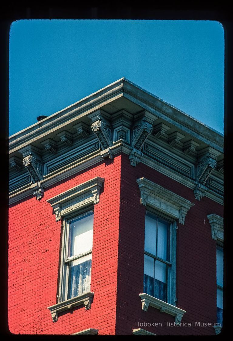 Color slide of detail view of cornice, brackets, dentils, frieze and window heads at 400 Grand on the NW corner with 4th picture number 1