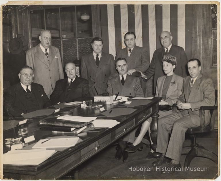 Charles F. Kaegebehn (seated at head of table)