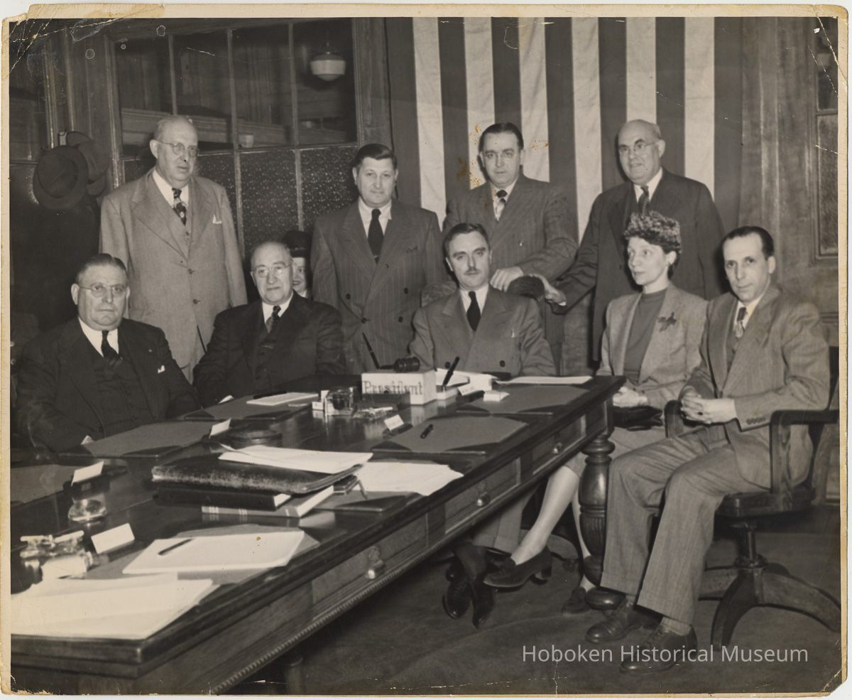 Charles F. Kaegebehn (seated at head of table)