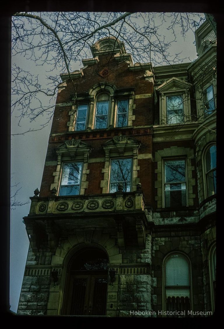 Color slide of eye-level view of brownstone façade showing portico, balconet and bracketed pediments at 925 Hudson between 9th & 10th picture number 1