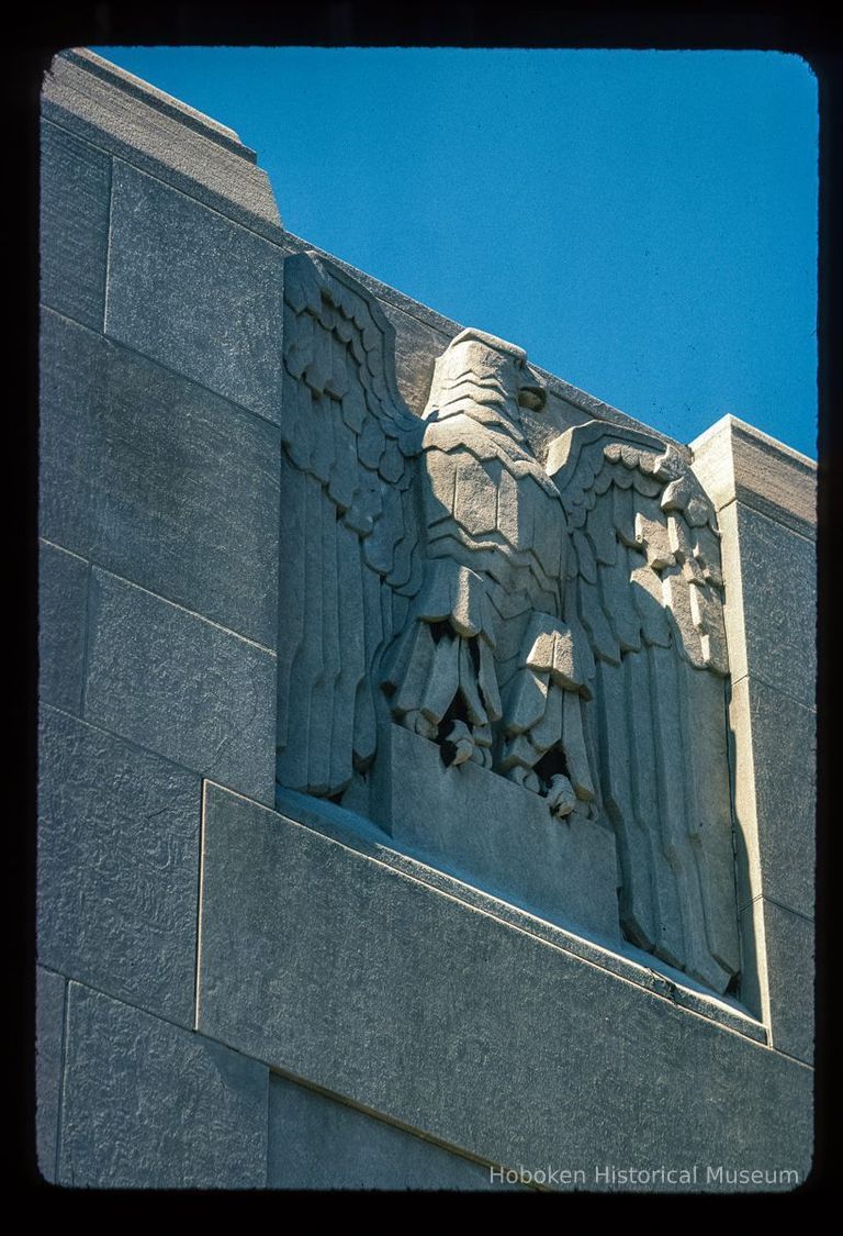 Color slide of close-up view of eagle bas-relief on the Steneck Trust Company building at 330 Grand on the SW corner with 4th picture number 1