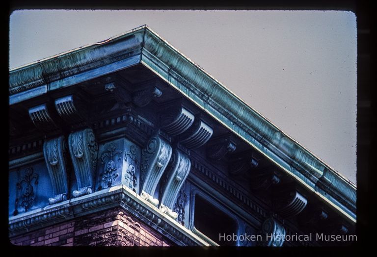 Color slide of detail view of cornice, brackets and frieze at 1001 Washington on the NE corner with 10th picture number 1