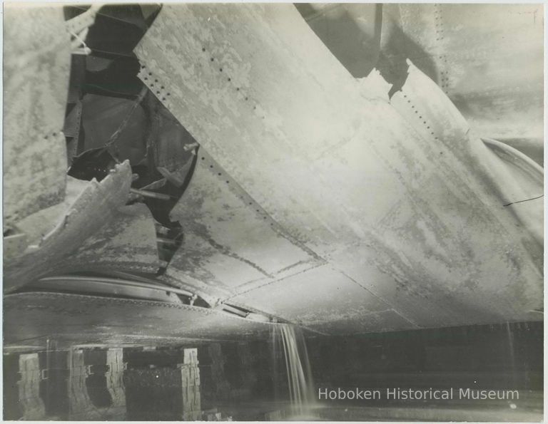 B+W photo of exterior view of damaged hull plates near keel on unidentified vessel at the Bethlehem Steel Shipyard, Hoboken Division, no date, ca. 19 picture number 1