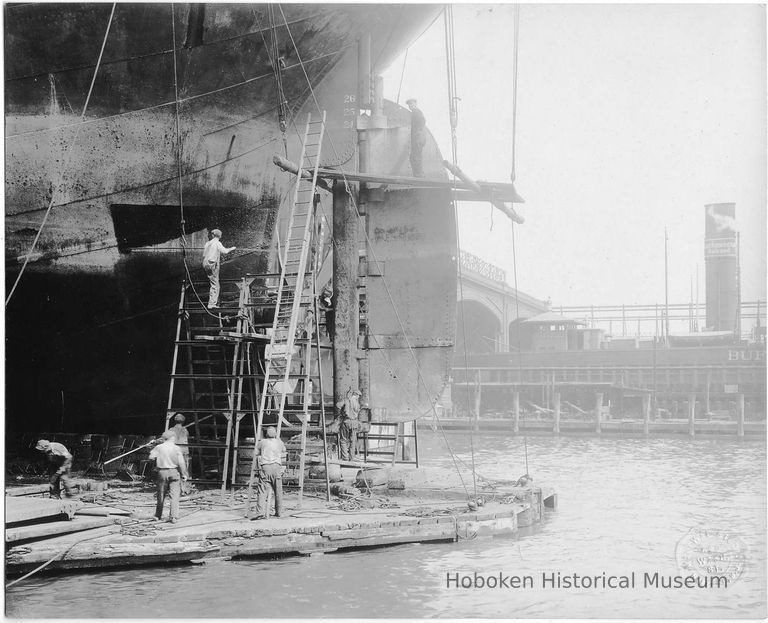 B+W photo of steerage repair to an unknown ship in a dry dock south of the Lackawanna Ferry Terminal, Hoboken, no date, ca. 1922-1930. picture number 1