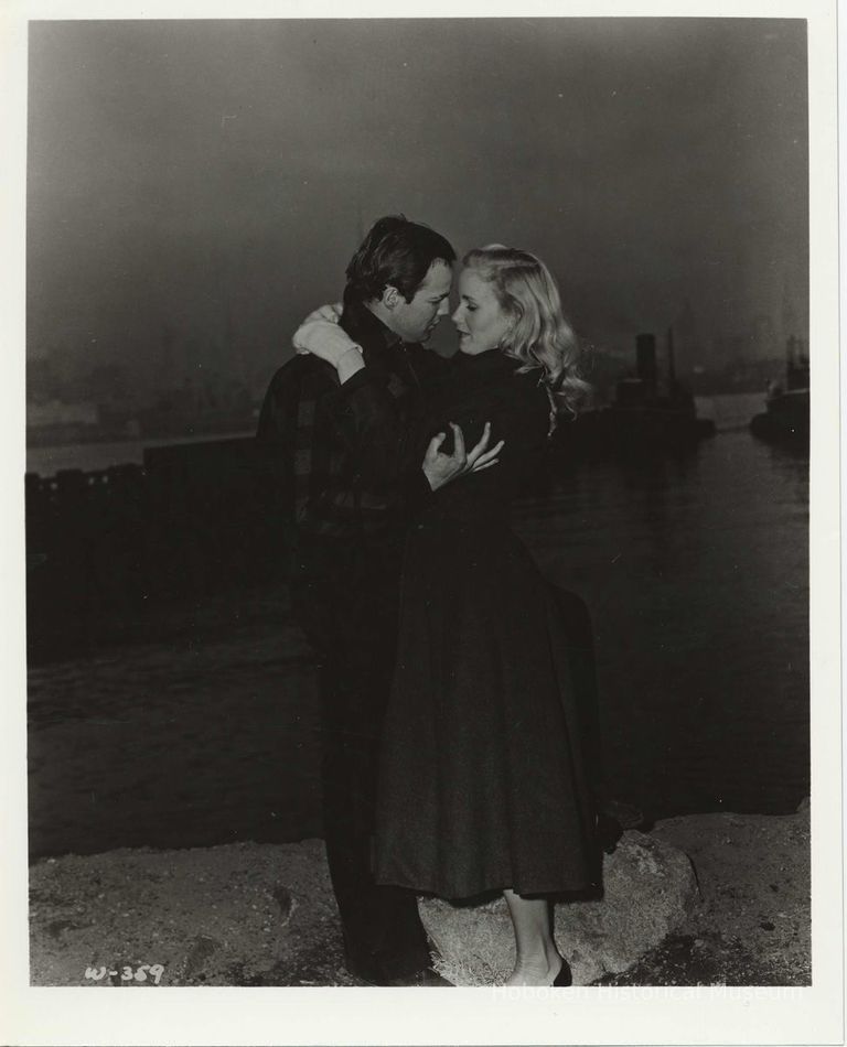 B+W publicity photo of Marlon Brando as Terry Malloy with Eva Marie Saint as Edie Doyle in film 