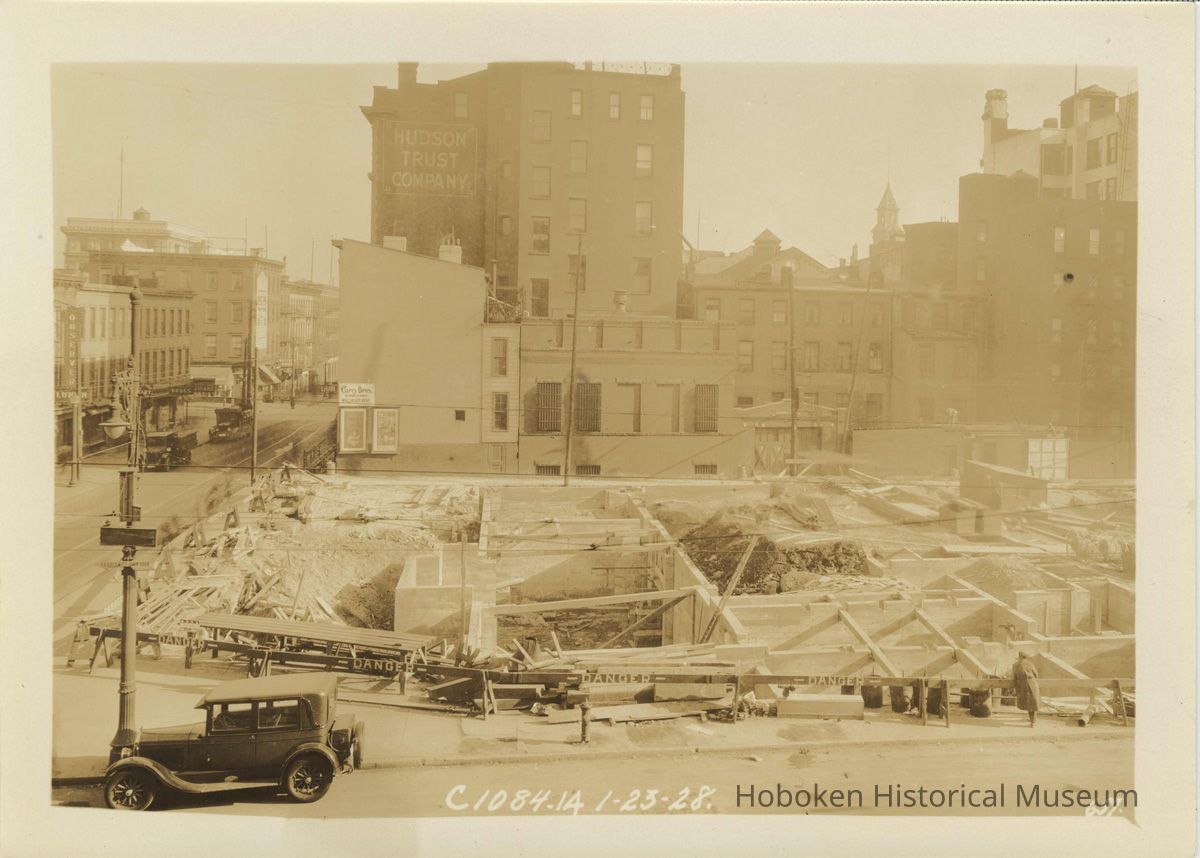 Sepia-tone photo of progress on foundation construction on the site for the Fabian Theatre, Newark & Washington Sts., Hoboken, Jan. 16, 1928. picture number 1