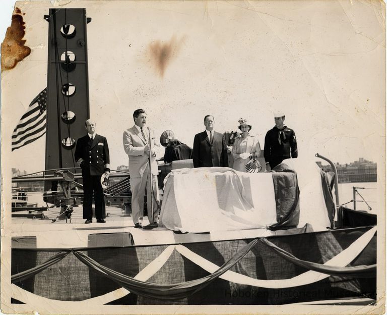 B+W photo of ceremony with John J. Grogan et al aboard a ship, probably docked in Hoboken, no date, ca. 1953-1959. picture number 1