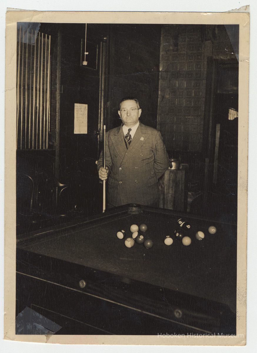 photo 1, image: Ralph Riccio inside his pool hall, 634 Grand St.