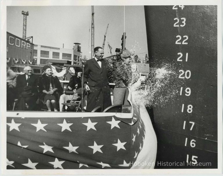 B+W photo of a Mrs. Walter Rice christening the S.S. Walter Rice in Todd Shipyards, Hoboken, Feb. 23, year not known. picture number 1