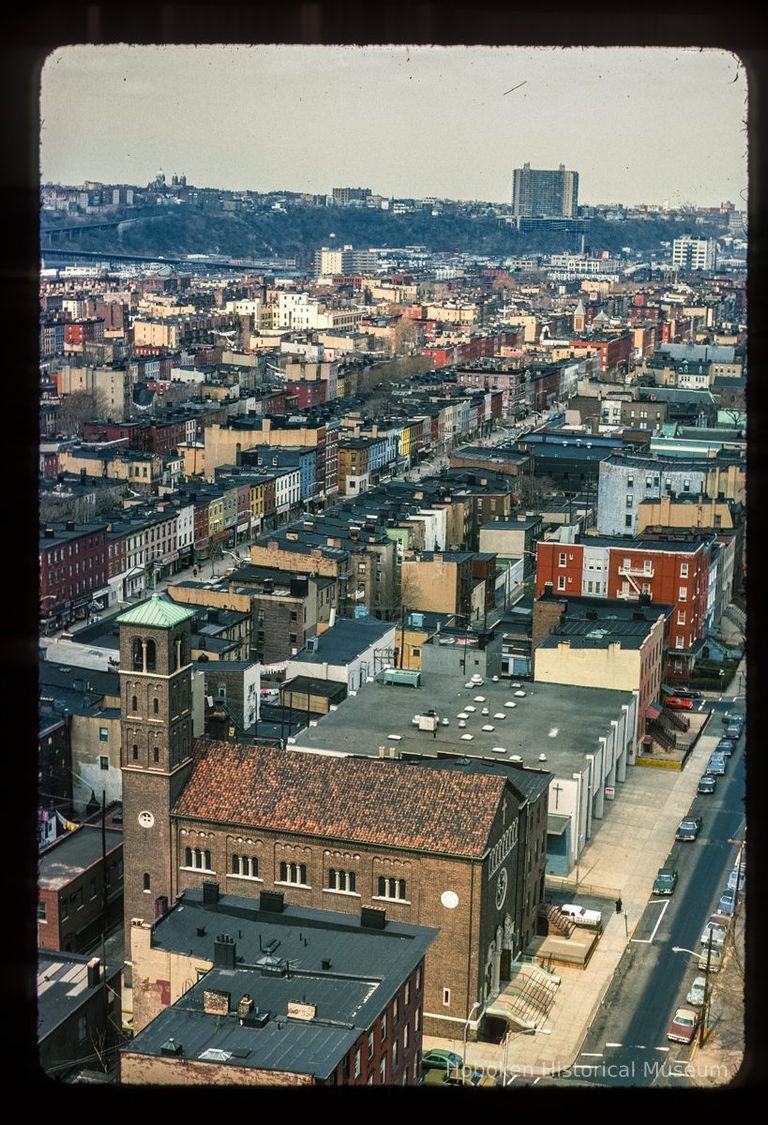 Color slide of aerial view from River & 3rd looking N. Saints Peter & Paul Catholic church at Hudson & 4th is in the foreground with Troy Towers on the Palisades picture number 1