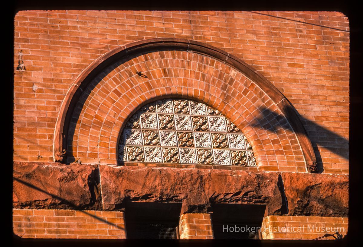 Color slide of close-up view of brickwork, gauged arch and decorative tiles on the façade of the First Baptist Church at 901 Bloomfield on the corner of Bloomfield and 9th picture number 1