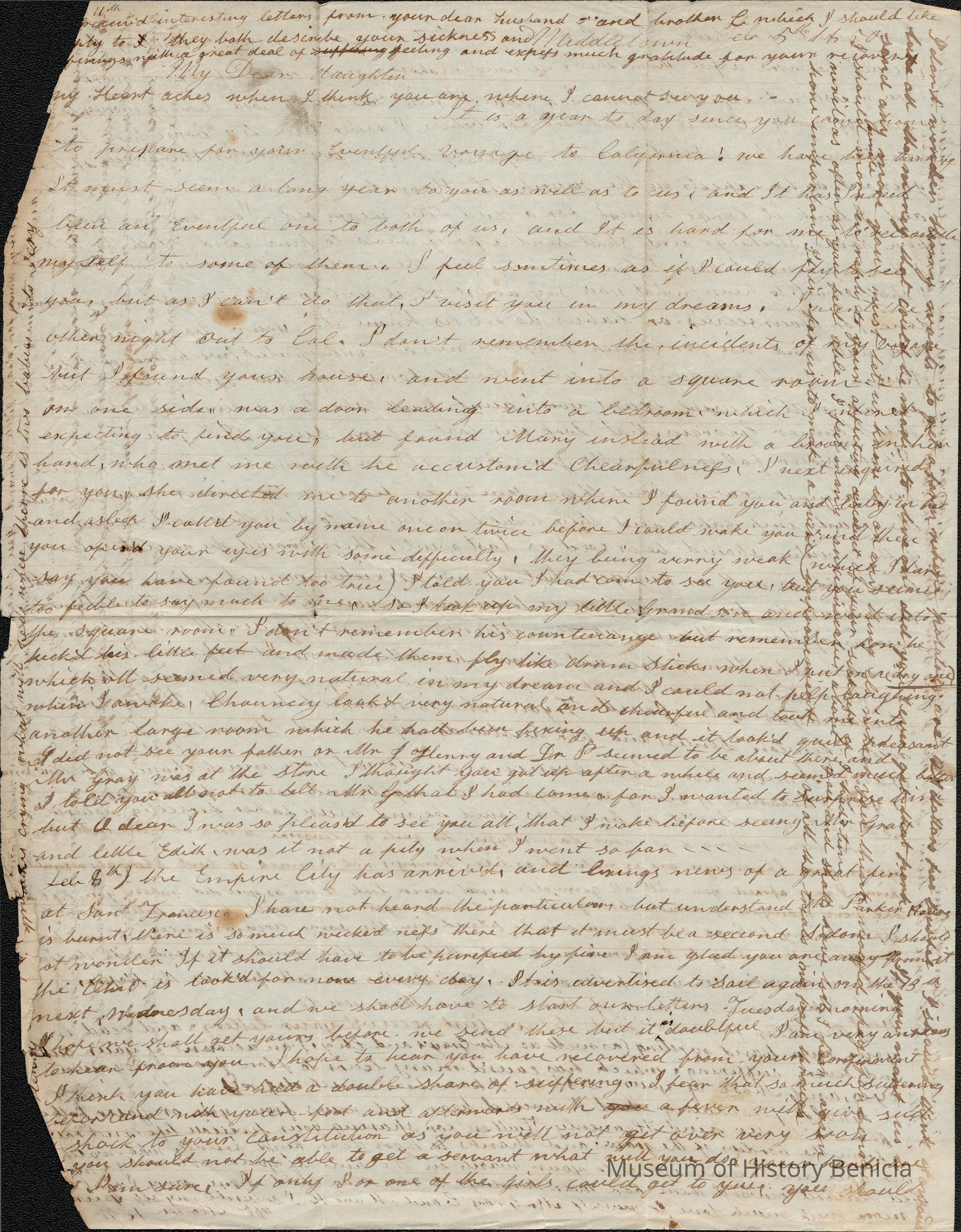 The image depicts a handwritten letter from Rebecca Hubbard Wetmore to her daughter, Lucy Gray. The document displays a timeworn appearance, typical of aged paper, with an overall yellowish tint and signs of creases and wear. The writing is dense, spanning both horizontally across the page's main body and perpendicularly in the margins, suggesting limited space. The script is in cursive, with variations indicative of the writer's personal style. Some areas contain noticeable ink blots or minor stains, contributing to the historical artifact's authenticity. The text covers family matters and emotional expressions, conveying a personal narrative.