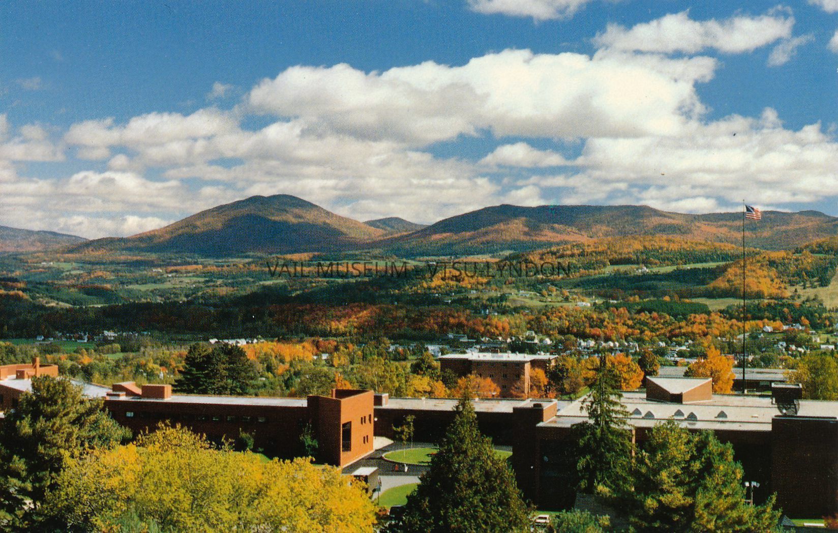 Lyndon State College campus with Burke Mountain across the valley - Roger S. Cloutier photo: From left, T.N. Vail Center - Burke Mountain - Science Wing -Wheelock dormitory - Alexander Twilight Theatre - Rooftops of Harvey Academic Center and Samuel Read Hall Library - American Flag is pictured atop the original flagpole from the T.N. Vail estate