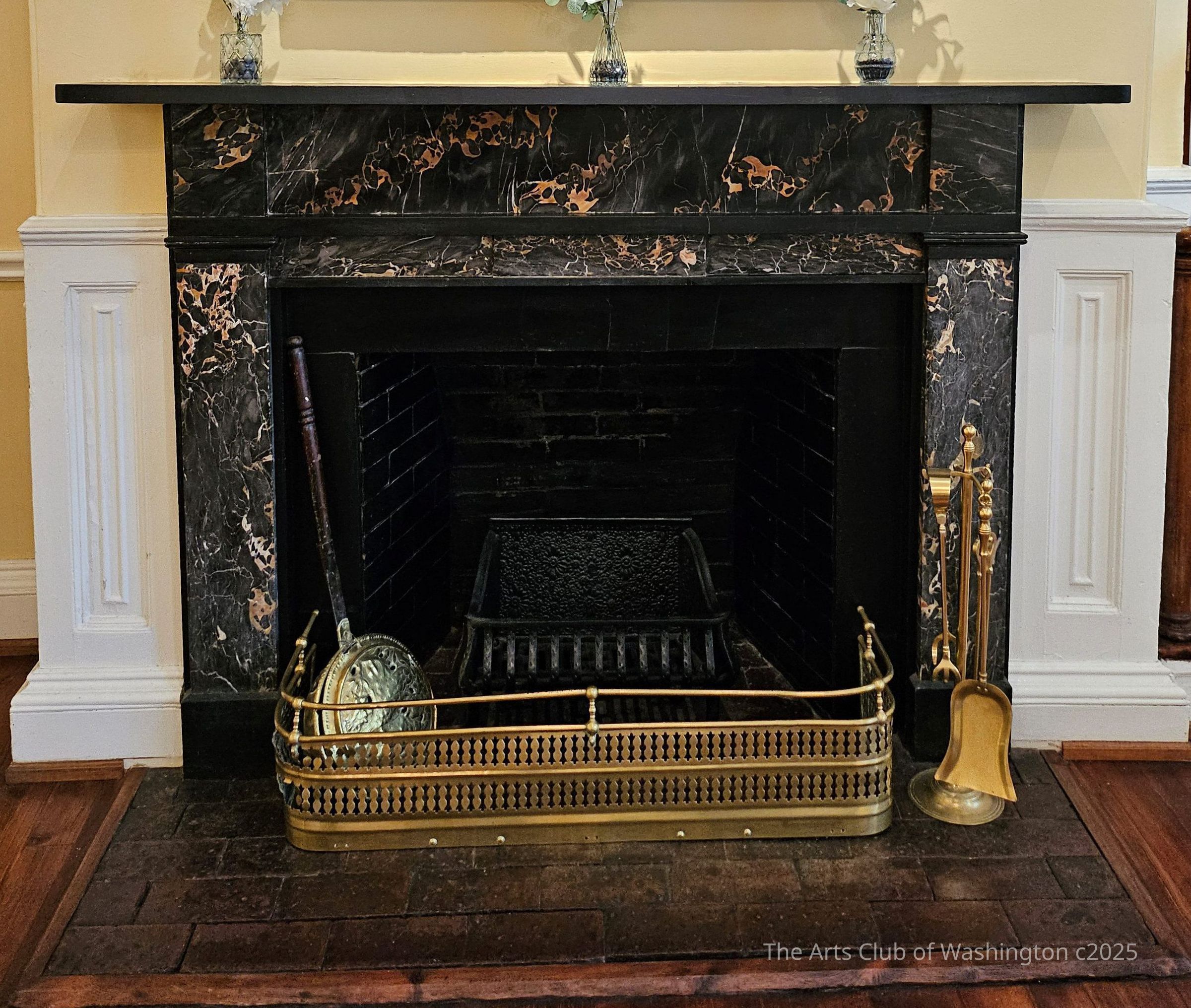 Mantel, unknown maker, Nero Portoro marble, first half of the 19th c.: The side legs of the mantel are supported on plinth bases topped with capitals, and support a mantle shelf above the header. The header, capitals, and legs are all highly figured black marble with gold veins while the shelf, bandings, and plinth bases are plain black marble with no veining.