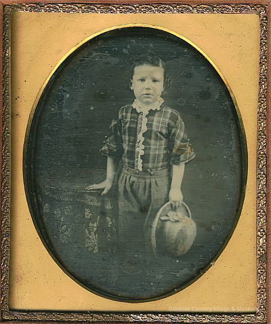Boy in Plaid Top with Beaver Hat