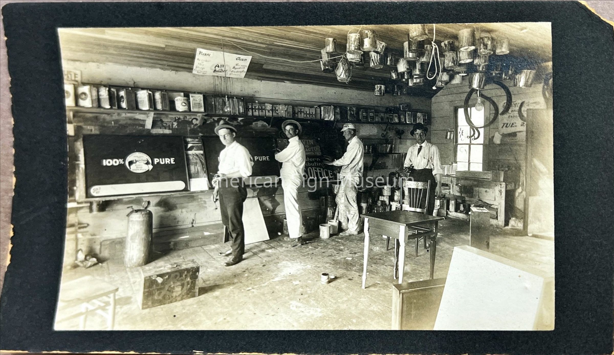 Sign Shop Interior with Workers - Photograph picture number 1