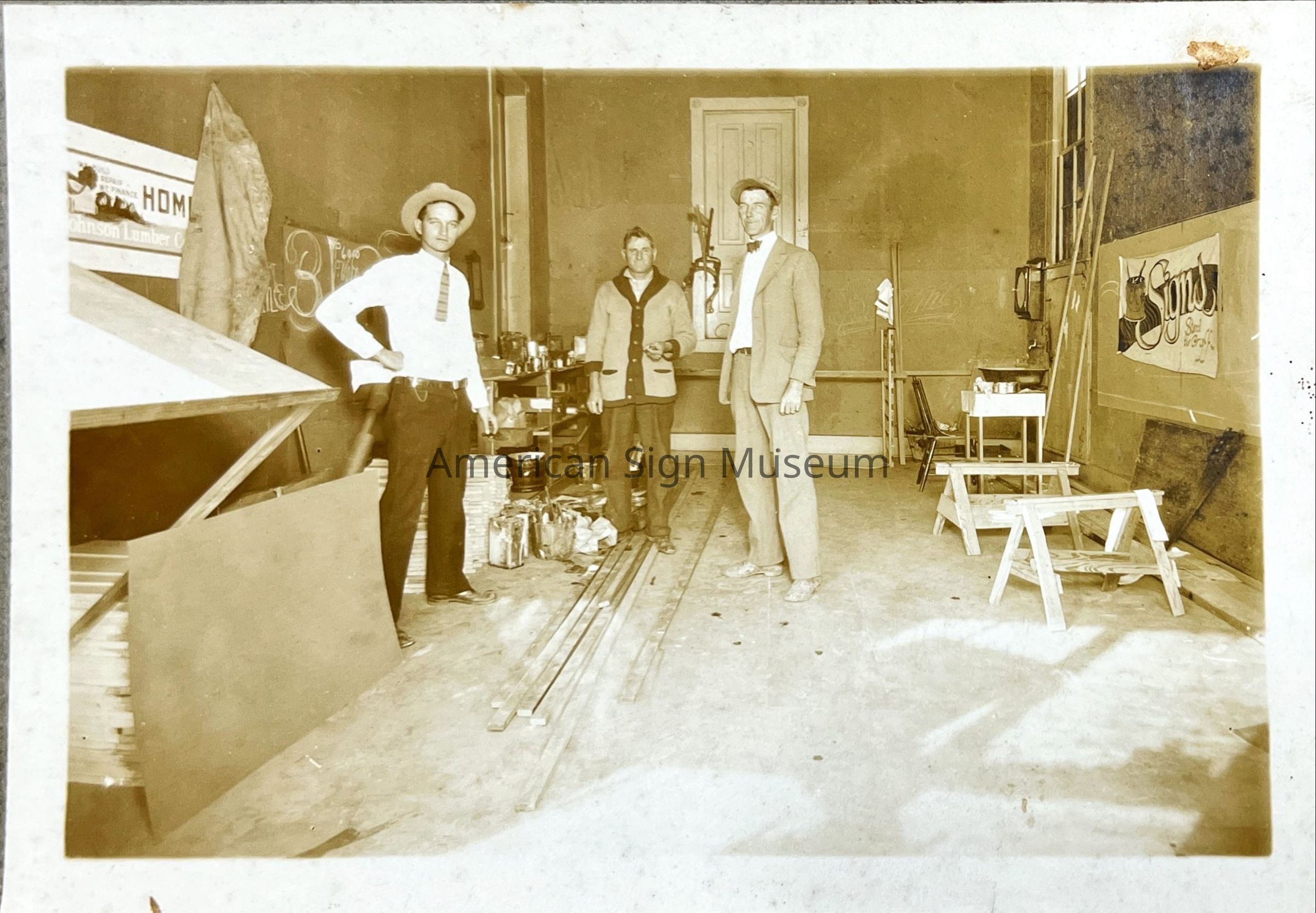Sign Shop Interior with Workers - Photograph picture number 1
