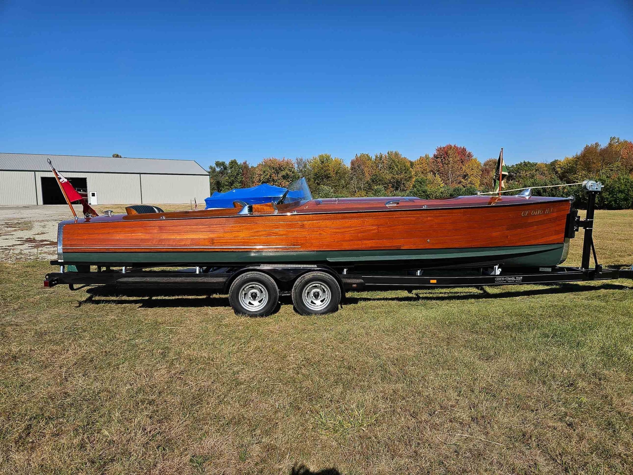 Excellent example of an early Barnes Long Deck Launch.