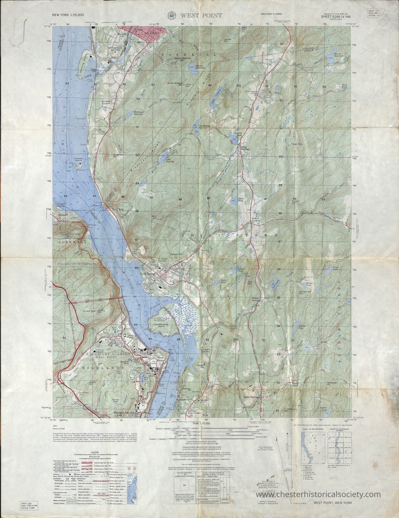 West Point, New York 1:25,000 Map: This image is a detailed topographic map of the West Point area in New York, displaying geographic features like elevation contours, water bodies such as the Hudson River, and terrain details with green indicating woodland areas; red and black lines indicate roads, while grids denote coordinates for navigation; urban areas, including the U.S. Military Academy at West Point, are represented in the southern portion, demonstrating clear demarcations of various physical and man-made infrastructures; labels and legends provide additional information on map scale, symbols, and etc.