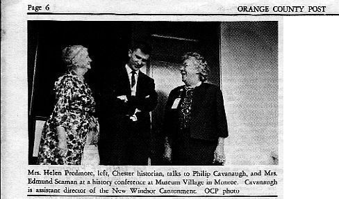 chs-000012 History Conference at Museum Village: Three individuals, identified in this clipping caption as Mrs. Helen Predmore, Chester historian, Philip Cavanaugh, the assistant director of the New Windsor Cantonment, and Mrs. Edmund Seaman, are engaged in a conversation at a history conference held at Museum Village in Monroe. The black-and-white photograph, featured on page 6 of the Orange County Post, captures Mrs. Predmore in a patterned dress on the left and Mrs. Seaman on the right, while Cavanaugh stands between them.