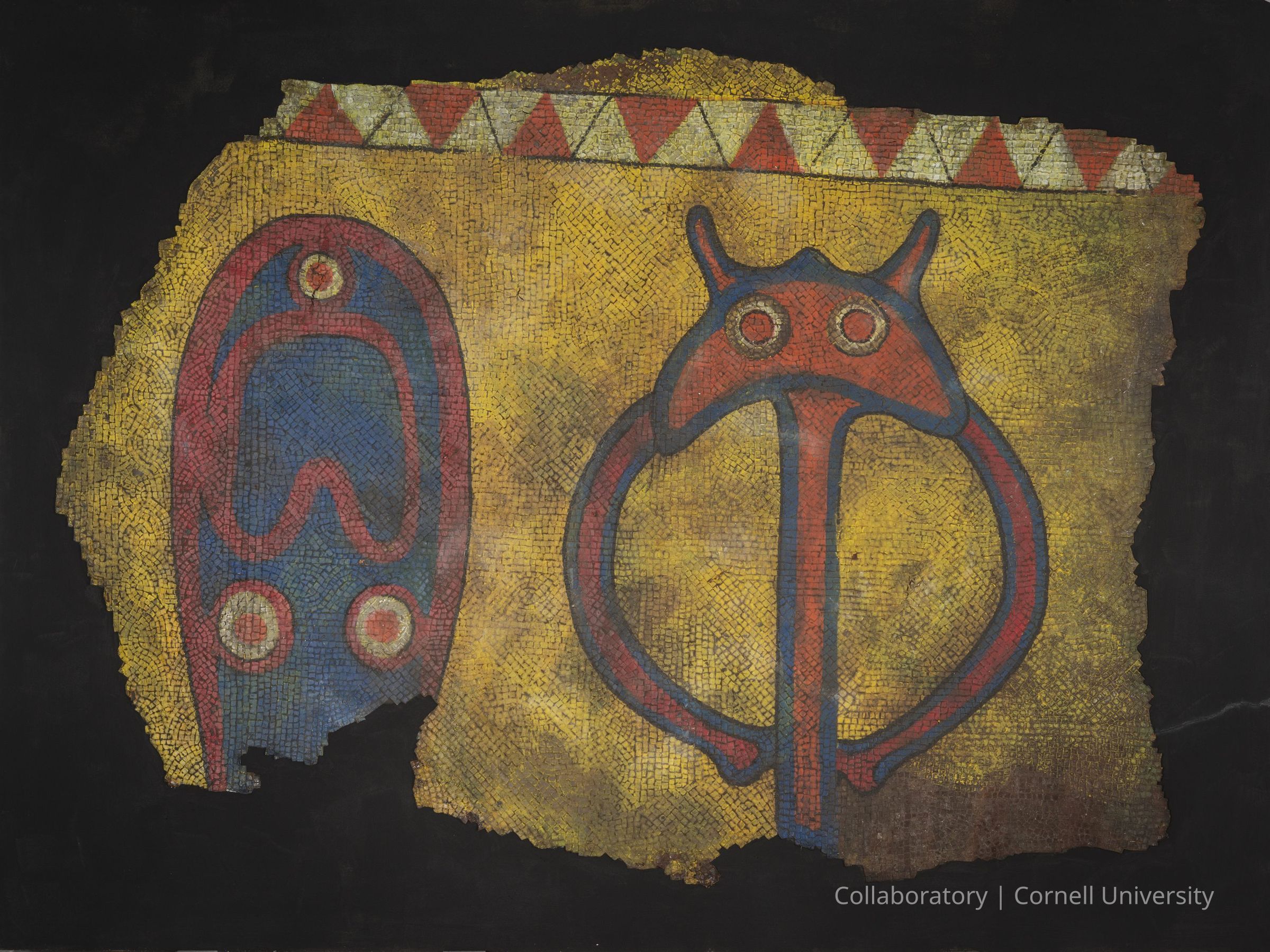 FLOOR MOSAIC FOR LLHUROSCIAN ROOM (Reconstruction) | circa 1984-91 | Photo by Ann Cady, 2024 | ©2026 Norman Daly Art: The photo depicts a large fragment of a floor mosaic showing two stylized figures on a golden-yellow background. The left figure (Token of Holmeek) resembles an abstract shape with blue, red, and circular elements, while the right figure (a Dwarf Monster) has horn-like protrusions and circular eyes, outlined in blue and red. Above the figures, a decorative border of alternating red and white triangles enhances the design. The mosaic is set against a dark background that accentuates the vivid colors and intricate details of the ancient floor.