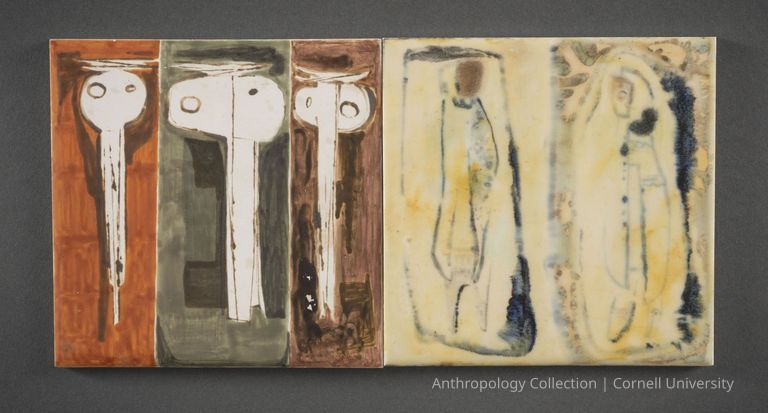 CERAMIC TILES | circa 1966-1971 Photo by Ann Cady, 2024 | ©2026 Norman Daly Art — This photo features two side-by-side earthenware plaques, each displaying abstract compositions in different color schemes—pale yellow with blue-black accents, muting browns and grays, and vibrant shades of orange and rust. Each plaque seems to incorporate a depiction of elongated, somewhat distorted figures or shapes that create a contemplative and eerie atmosphere, potentially hinting at themes of reflection or decay.