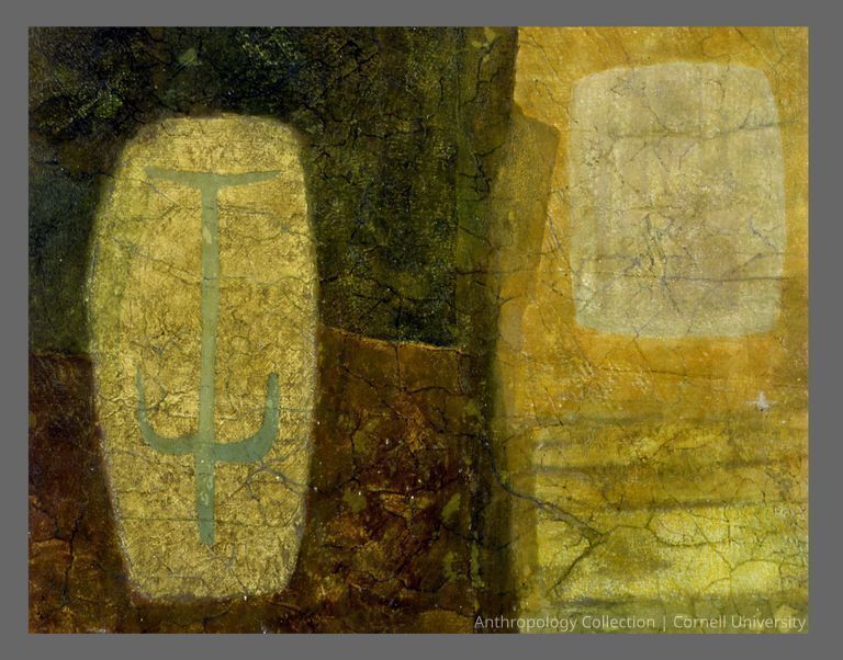 FACSIMILE OF CAVE PAINTING | circa 1971 | Photo by Ann Cady, 2024 | ©2026 Norman Daly Art — The painting is divided into uneven sections of golden and earth brown hues, with contrasting crisscross of shapes, fine cracks and subtle discoloration--all suggesting an ancient source. A distinct yet faded green  'orant' figure with a curved top piece, sits to the left.