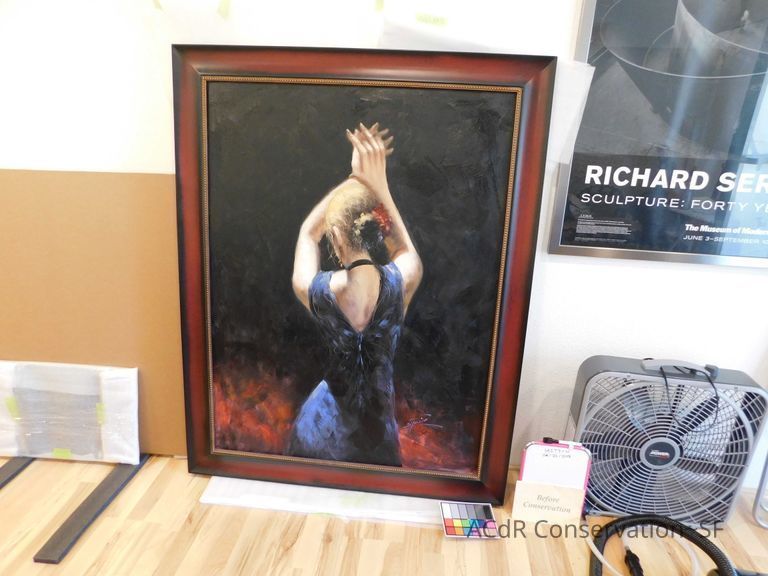 Woman in blue dress with raised arms