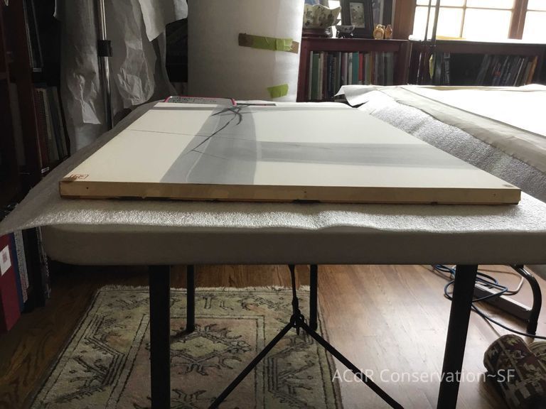 Before conservation - discolored edge of paper at the bottom. The discolored rusty patch on the left partially present at turn over edge. 