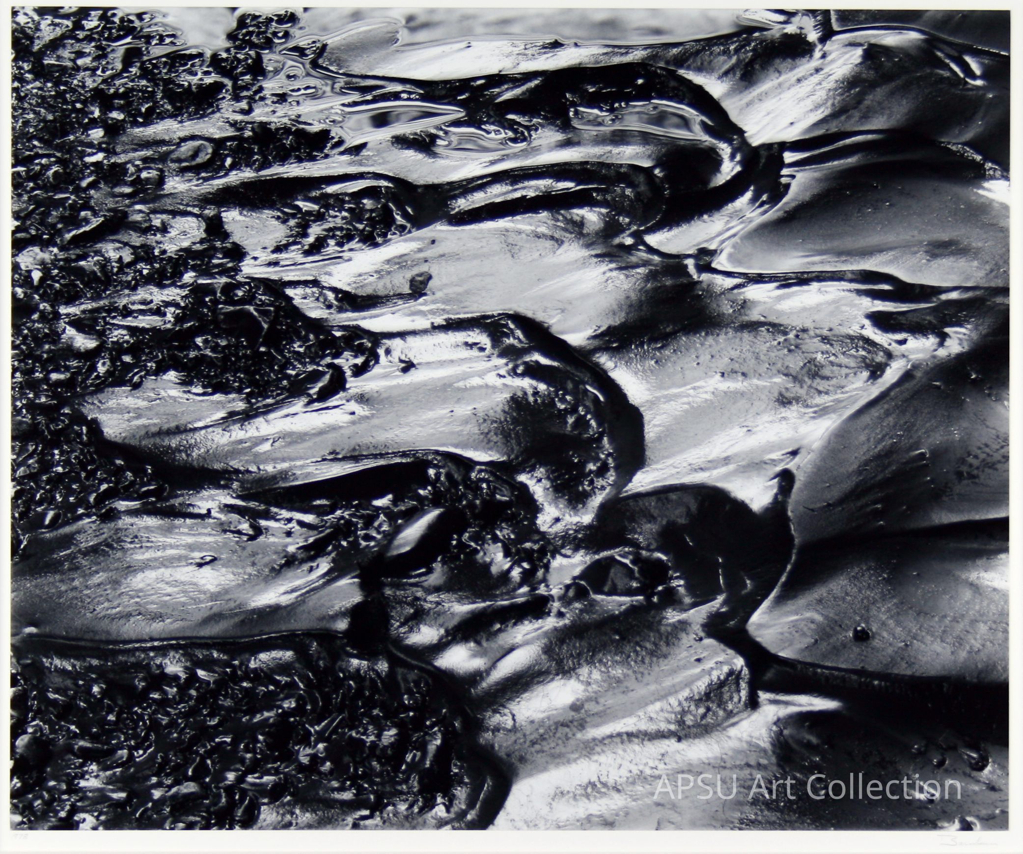 The image depicts a glossy, black, textured surface with intricate and varied patterns, resembling either an abstract painting with thick, waved brushstrokes or a close-up of a natural substance like tar or oil, showcasing a range of light reflections and depths, contributing to a visually striking and almost fluid dynamic appearance.