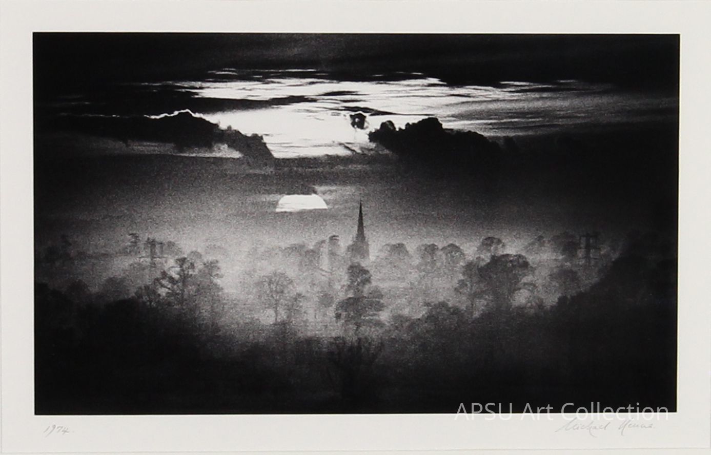 In this black and white image, a serene landscape unfolds with a prominent church spire rising through a thick mist, shrouding the surrounding trees and countryside, while a dramatic sky overhead features heavy clouds partially illuminated by the subdued light of either dawn or dusk, creating a mysterious and ethereal atmosphere that evokes a sense of timeless beauty and stillness.