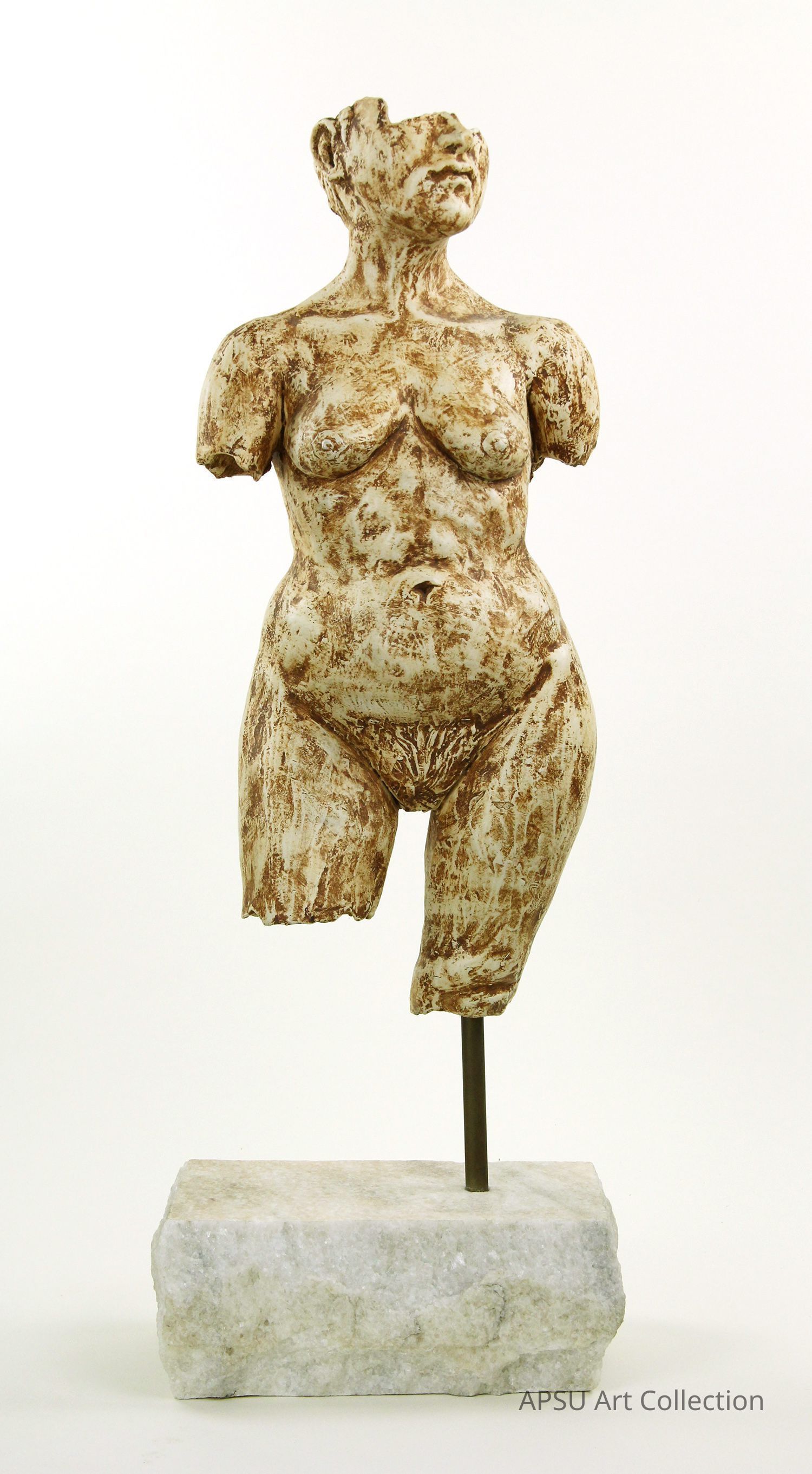 The image depicts a classical style sculpture of a partially fragmented female torso, positioned on a marble base and supported by a slender metal rod; the sculpture exhibits detailed texturing and earthy tones, emphasizing the contours and musculature of the figure, while the missing head and limbs suggest a timeless, ancient quality reminiscent of archaeological artifacts, inviting contemplation on the passage of time and the enduring strength present within the female form, all set against a neutral backdrop that highlights the sculpture's intricate features and craftsmanship.